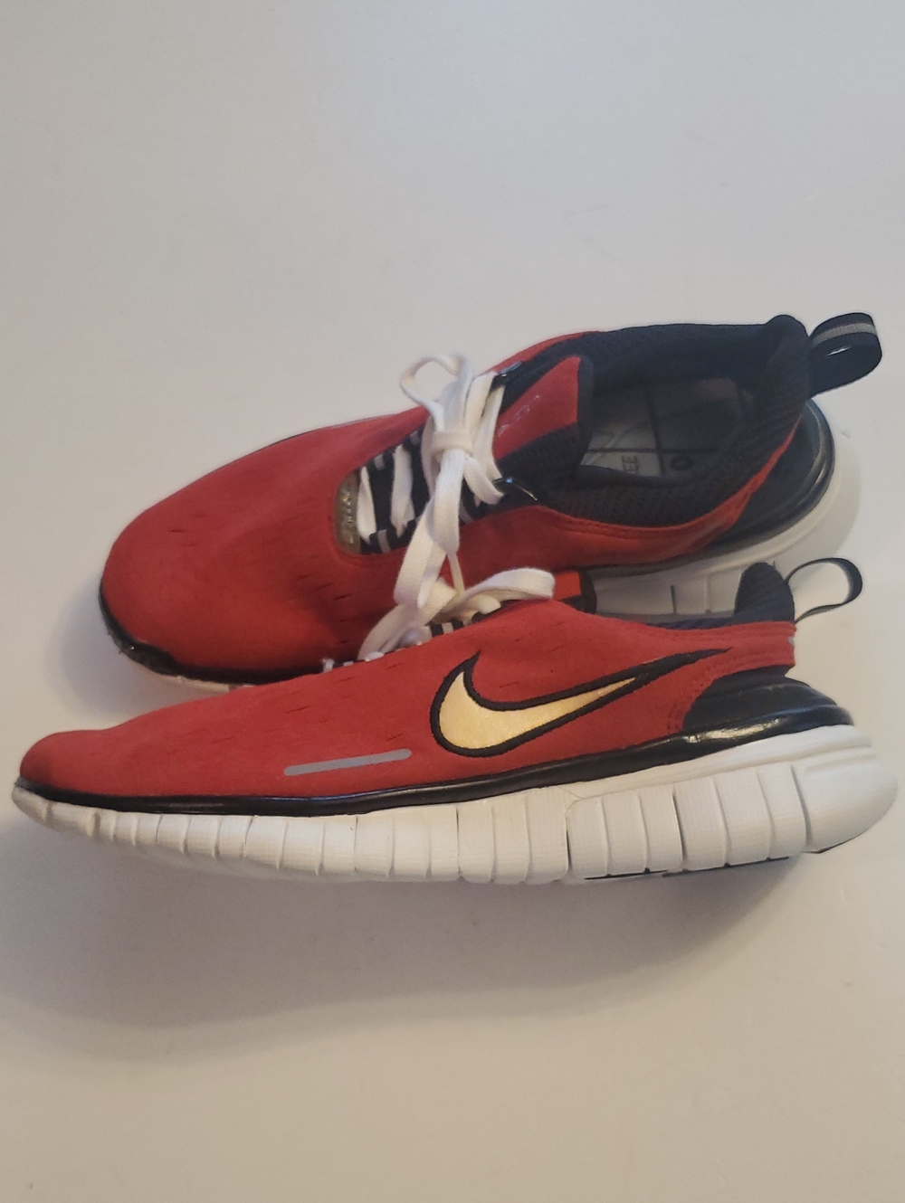 Nike Womens Red Sneakers with Gold Swoosh and White Sole